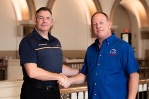two men shaking hands as Groundworks acquires FSM